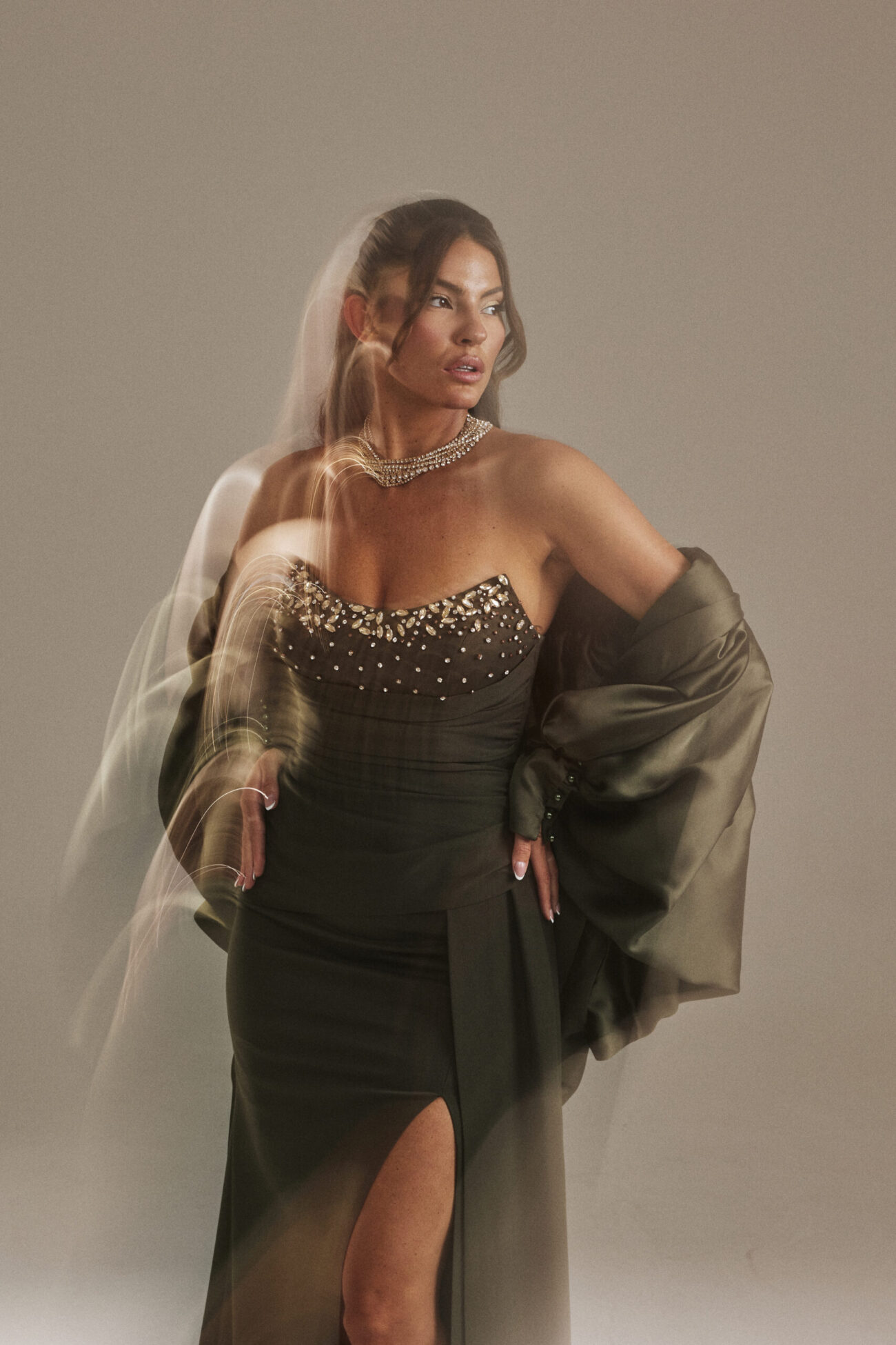 Editorial picture of Ôzé by THD Olive Puffy Cape in Olive Green
