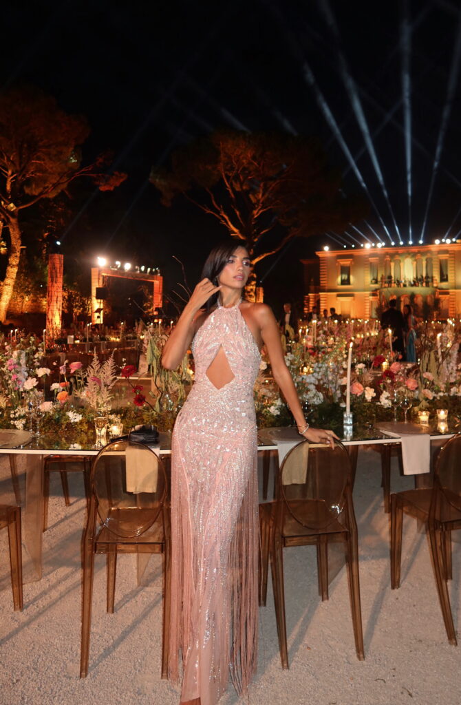 An editorial front picture of an oze by thd dress of Aurora haute couture gown in pink color